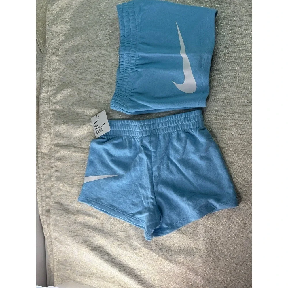 Two pairs of Nike baby blue short size 6
